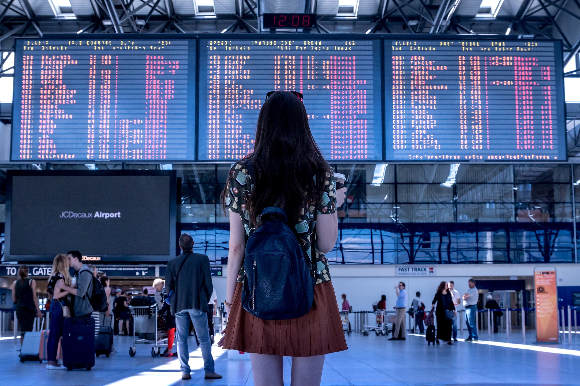 Travellers inside an airport terminal